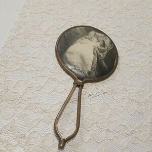 Vintage Art Nouveau hand mirror with antique baby photo